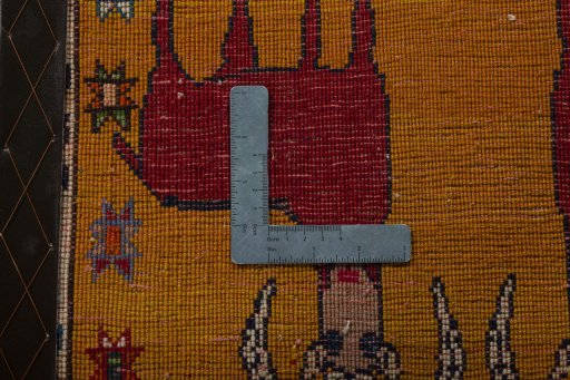 Backside of handmade 2000s Shiraz rug showing knot structure and weave density