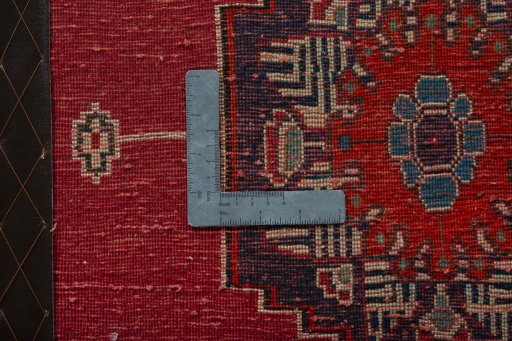 Backside of handmade 2000s Shiraz rug showing knot structure and weave density