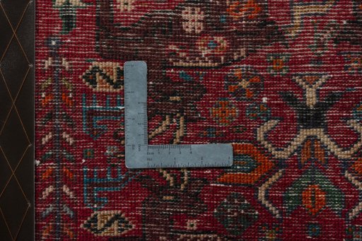 Backside of handmade 2000s Shiraz rug showing knot structure and weave density