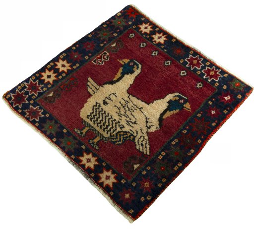 Corner detail of 2000s Shiraz rug showing border pattern and Wool pile