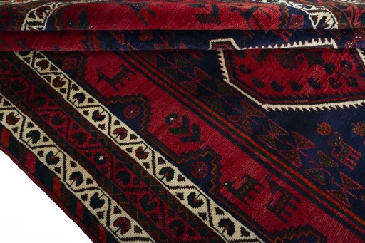 Corner detail of 2000s Shiraz rug showing border pattern and Wool pile