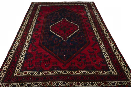 Surface texture of 2000s Shiraz rug with natural Wool and intricate pattern