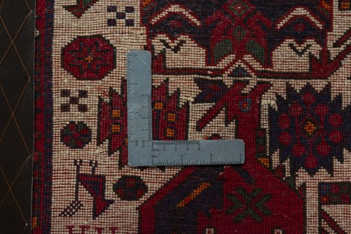Backside of handmade 2000s Shiraz rug showing knot structure and weave density