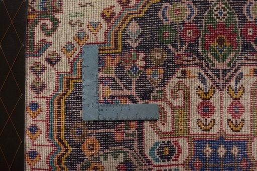 Backside of handmade 2000s Shiraz rug showing knot structure and weave density