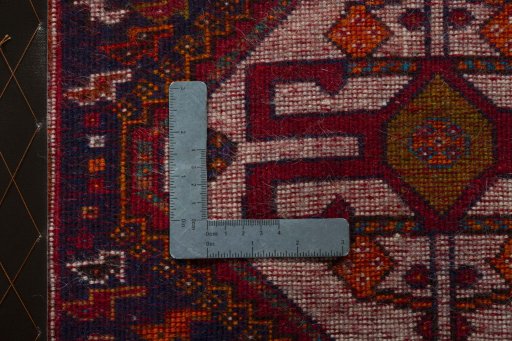 Backside of handmade 2000s Shiraz rug showing knot structure and weave density