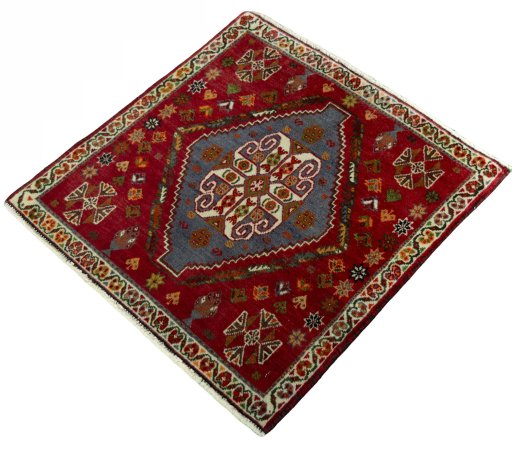 Corner detail of 2000s Shiraz rug showing border pattern and Wool pile