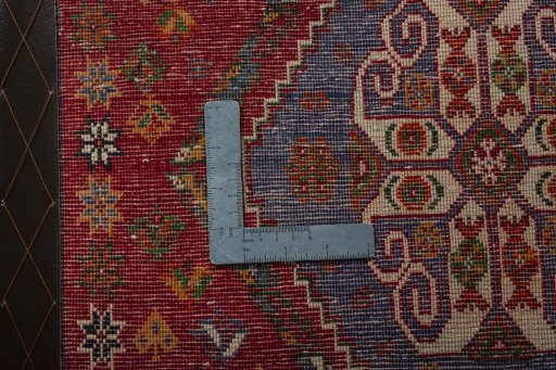 Backside of handmade 2000s Shiraz rug showing knot structure and weave density