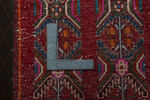Backside of handmade 2000s Shiraz rug showing knot structure and weave density