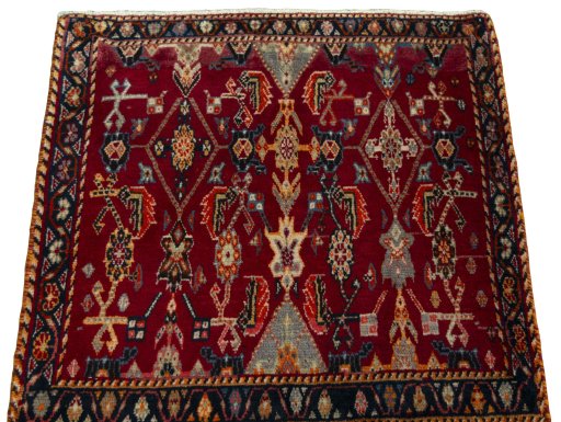 Surface texture of 2000s Shiraz rug with natural Wool and intricate pattern