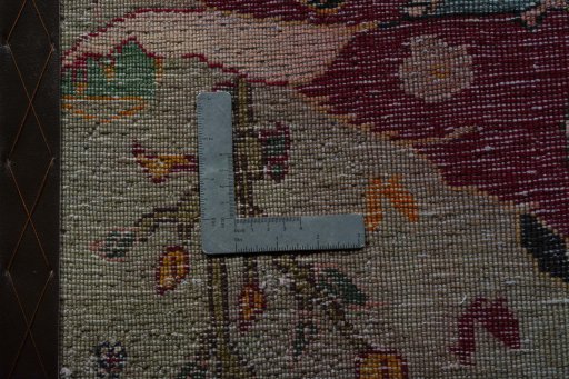 Backside of handmade 2000s Shiraz rug showing knot structure and weave density