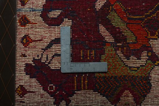 Backside of handmade 2000s Shiraz rug showing knot structure and weave density