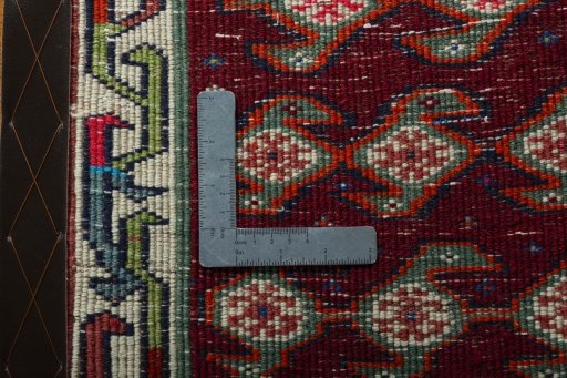Backside of handmade 2000s Shiraz rug showing knot structure and weave density