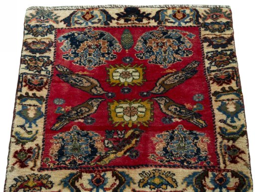 Surface texture of 2000s Shiraz rug with natural Wool and intricate pattern