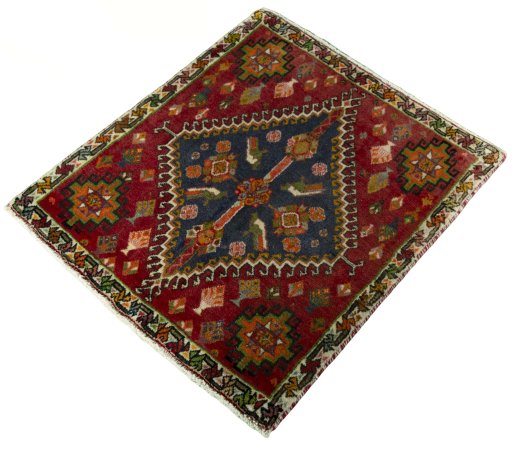 Corner detail of 2000s Shiraz rug showing border pattern and Wool pile