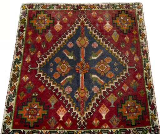 Surface texture of 2000s Shiraz rug with natural Wool and intricate pattern