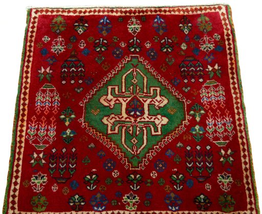 Surface texture of 2000s Shiraz rug with natural Wool and intricate pattern