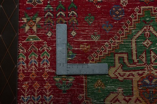 Backside of handmade 2000s Shiraz rug showing knot structure and weave density