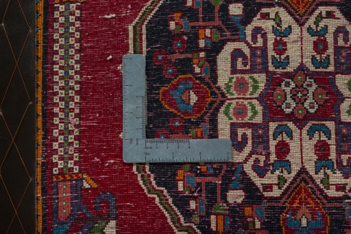 Backside of handmade 2000s Shiraz rug showing knot structure and weave density