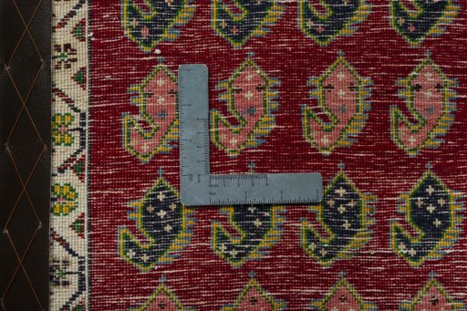 Backside of handmade 2000s Shiraz rug showing knot structure and weave density