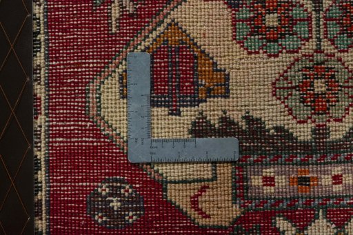 Backside of handmade 2000s Shiraz rug showing knot structure and weave density