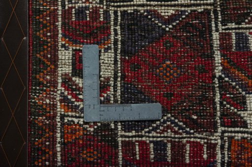 Backside of handmade 2000s Shiraz rug showing knot structure and weave density
