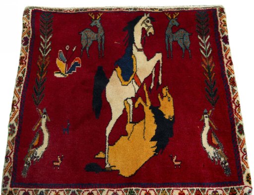 Surface texture of 2000s Shiraz rug with natural Wool and intricate pattern