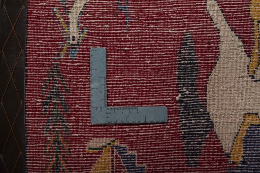 Backside of handmade 2000s Shiraz rug showing knot structure and weave density