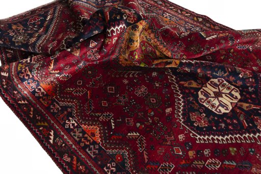 Corner detail of 1970s Shiraz rug showing border pattern and Wool pile