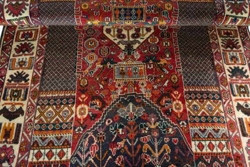 Full view of 1970s Shiraz rug from Iran / Persia, 251 × 150 cm in Red tones