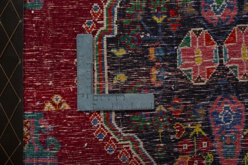Backside of handmade 2000s Shiraz rug showing knot structure and weave density