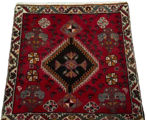 Surface texture of 2000s Shiraz rug with natural Wool and intricate pattern