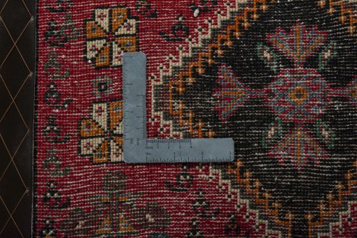 Backside of handmade 2000s Shiraz rug showing knot structure and weave density