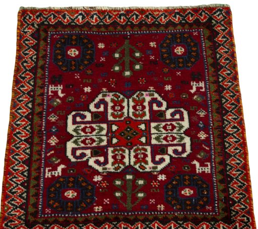 Surface texture of 2000s Shiraz rug with natural Wool and intricate pattern