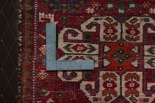 Backside of handmade 2000s Shiraz rug showing knot structure and weave density