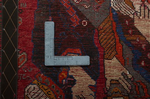 Backside of handmade 2000s Shiraz rug showing knot structure and weave density