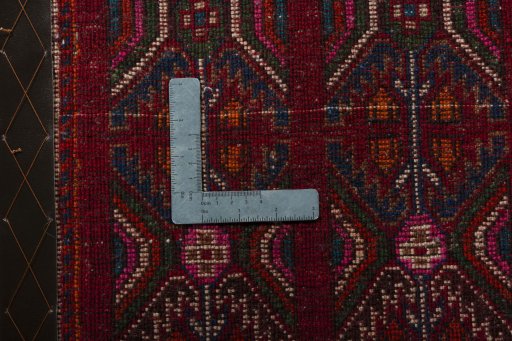 Backside of handmade 2000s Shiraz rug showing knot structure and weave density