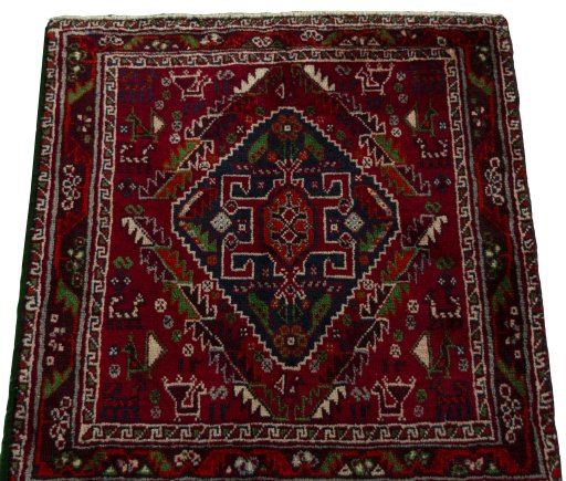 Surface texture of 2000s Shiraz rug with natural Wool and intricate pattern