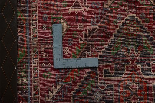 Backside of handmade 2000s Shiraz rug showing knot structure and weave density