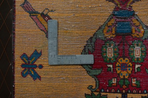 Backside of handmade 2000s Shiraz rug showing knot structure and weave density