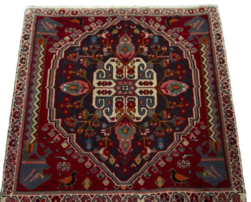 Surface texture of 2000s Shiraz rug with natural Wool and intricate pattern