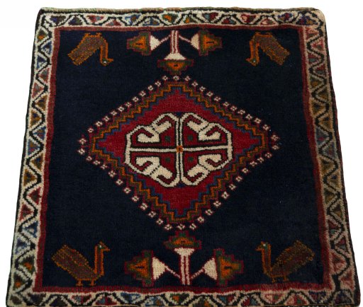 Surface texture of 2000s Shiraz rug with natural Wool and intricate pattern