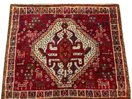 Surface texture of 2000s Shiraz rug with natural Wool and intricate pattern