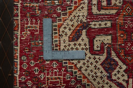 Backside of handmade 2000s Shiraz rug showing knot structure and weave density