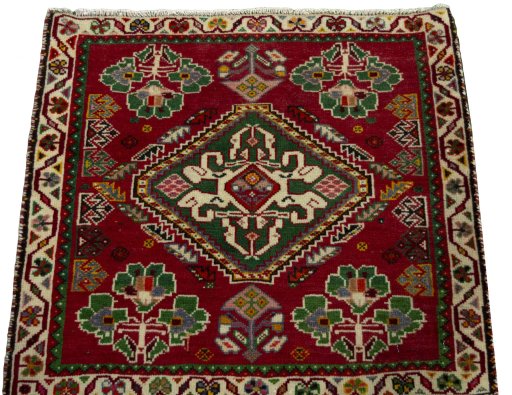 Surface texture of 2000s Shiraz rug with natural Wool and intricate pattern
