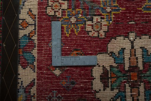 Backside of handmade 2000s Shiraz rug showing knot structure and weave density