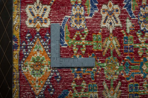 Backside of handmade 2000s Shiraz rug showing knot structure and weave density