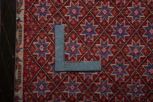 Backside of handmade 2000s Shiraz rug showing knot structure and weave density