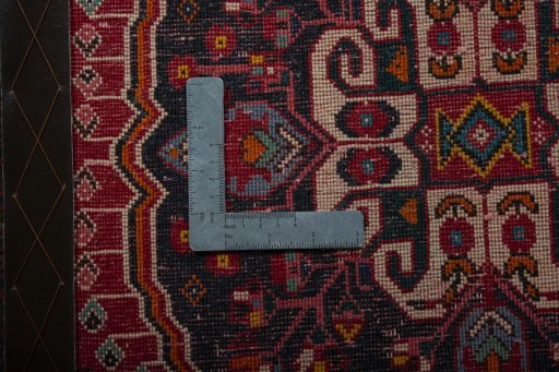Backside of handmade 2000s Shiraz rug showing knot structure and weave density