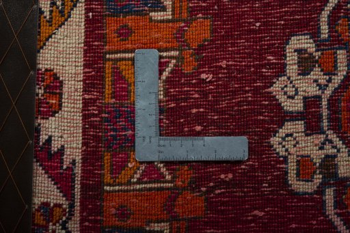 Backside of handmade 2000s Shiraz rug showing knot structure and weave density