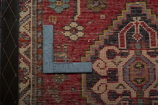 Backside of handmade 2000s Shiraz rug showing knot structure and weave density